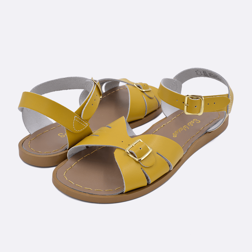 Two 900 Classic style sandal color mustard. Both pushed together facing the camera diagonally.	Adult Size.